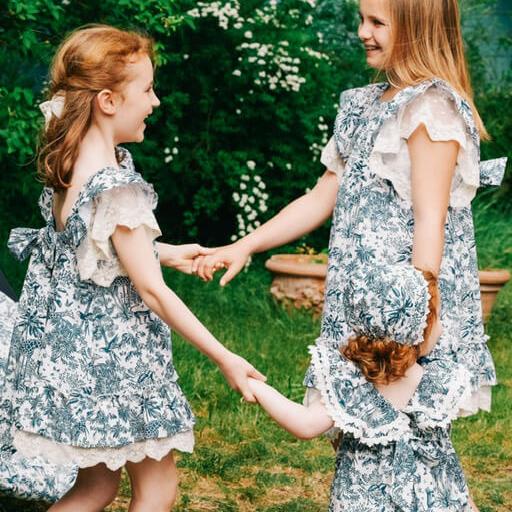 Girls wearing Premium European dresses in toile de jouy