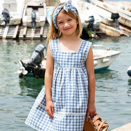 girl wearing premium European blue gingham dress