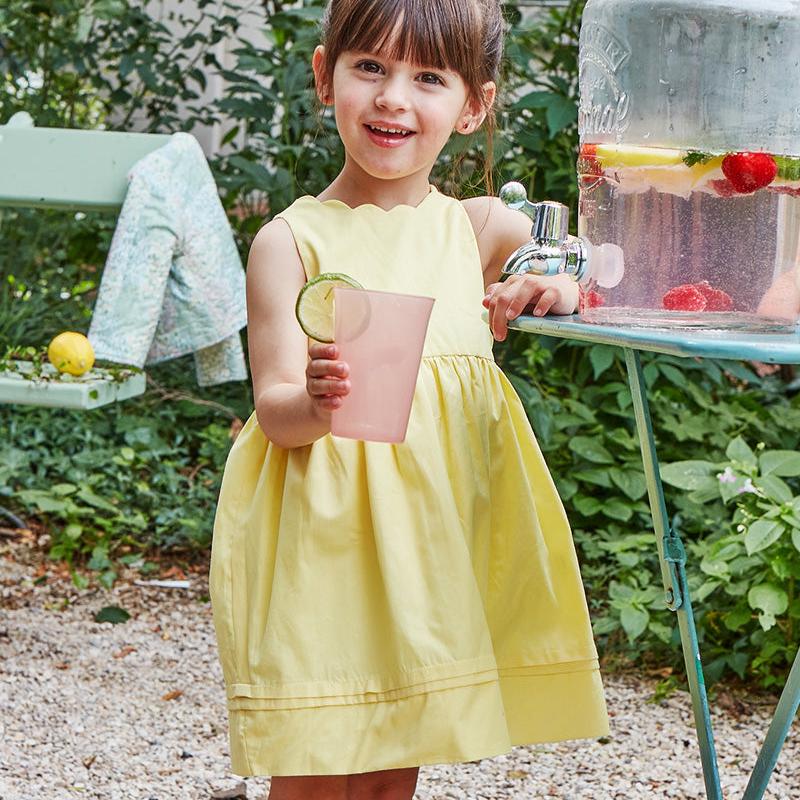 girl wearing premium European scalloped neckline dress