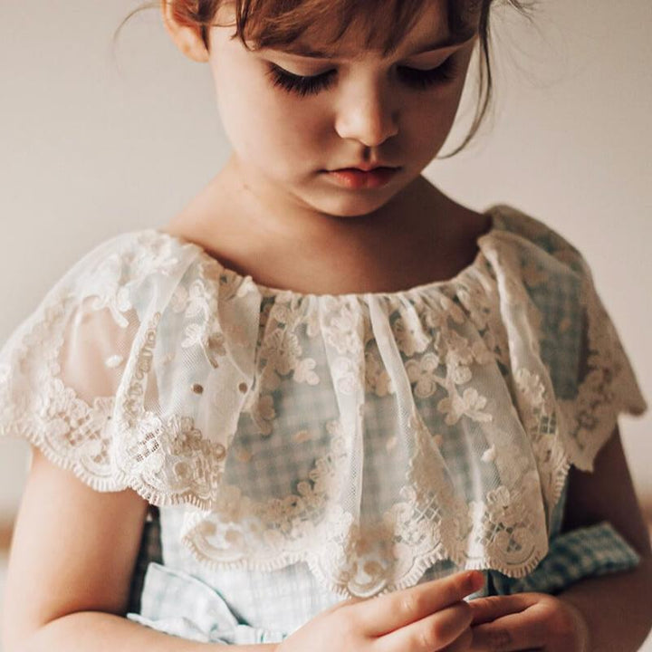 Lace collar detail view of premium European blue gingham dress for girls